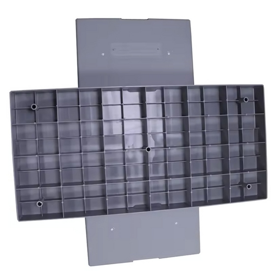 Gray plastic mold with grid pattern on a white background